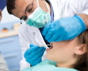 Patient examined in dental chair
