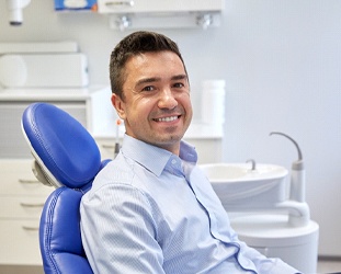 Smiling male patient waiting in endodontist’s office