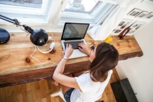 A woman on a computer.