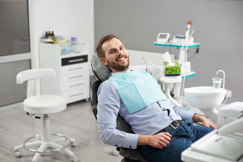 Male patient in dental chair waiting for endodontist