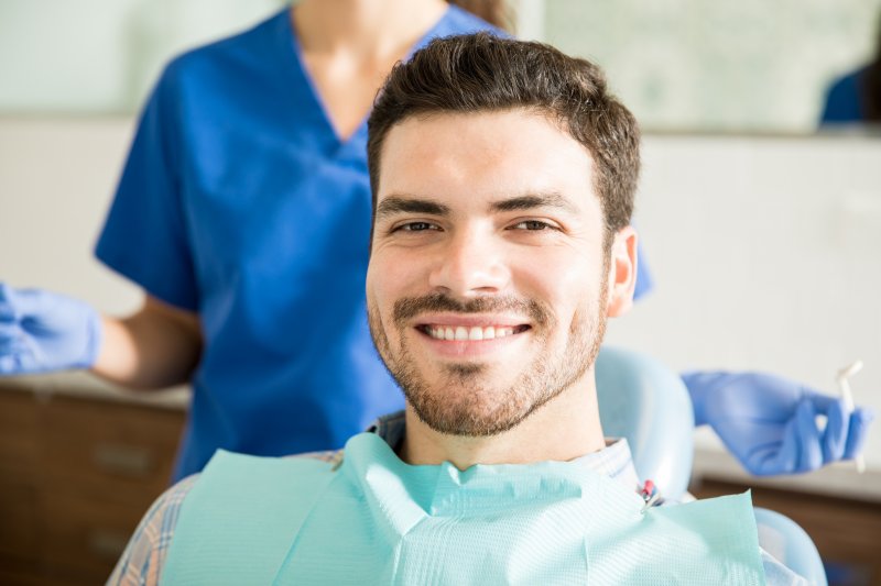 Man smiling after root canal therapy