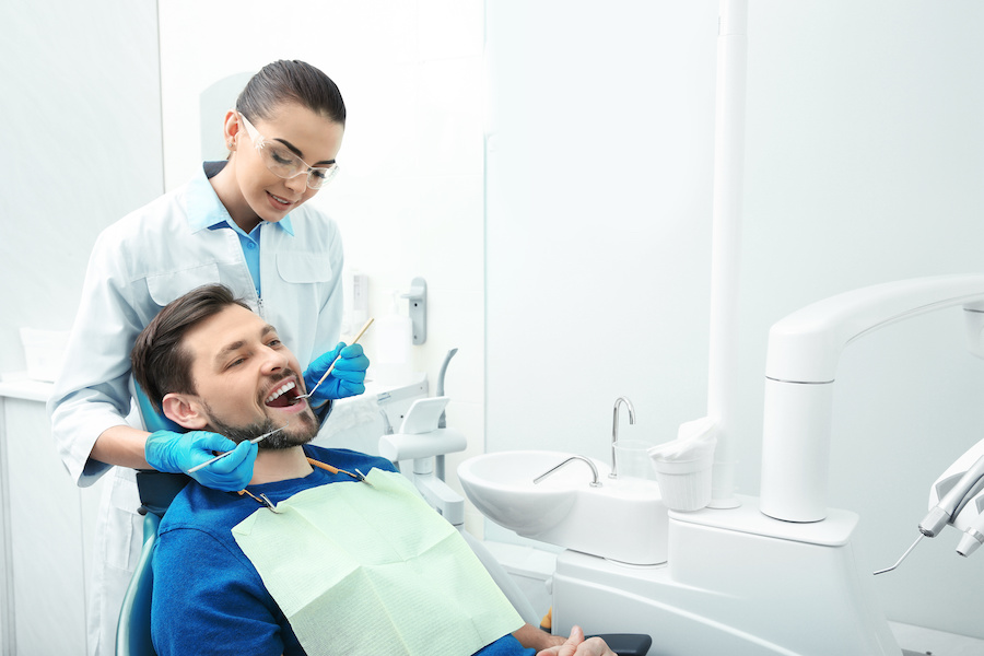 Man getting dental work done in office