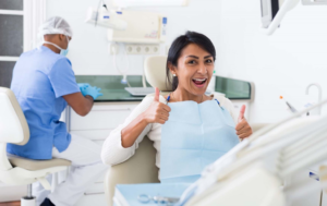 a patient smiling while visiting their endodontist