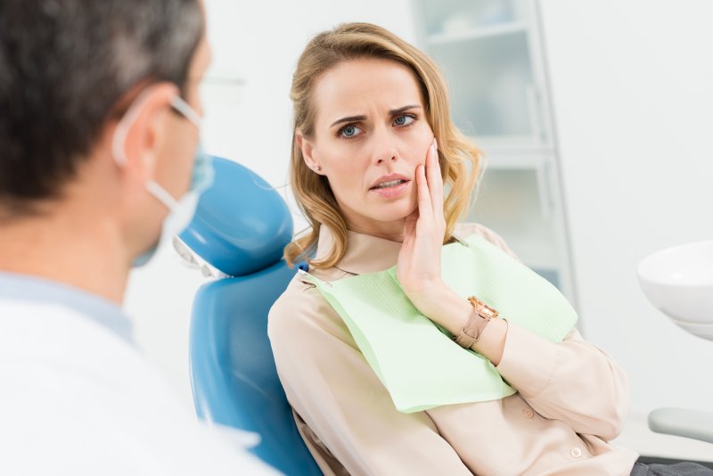 Patient talking to their dentist about root canals
